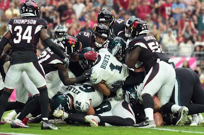 Jalen Hurts and Jason Kelce execute the contentious play known as the tush push or Brotherly Shove